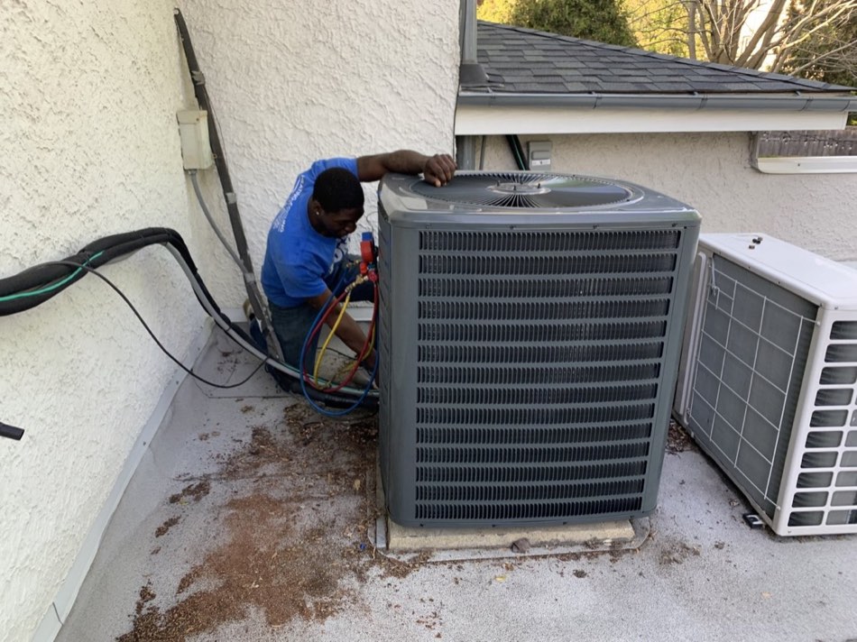 Tone servicing an air conditioner condenser